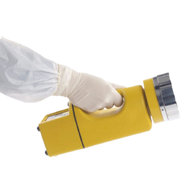Air sampler certification — gloved hand holding yellow device