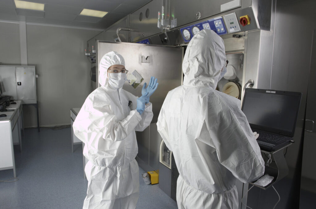 Cleanroom certification and testing technicians in a USP 825 cleanroom space