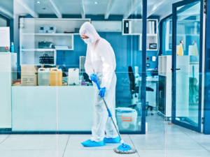 Controlled environment services technician mopping a sterile facility floor
